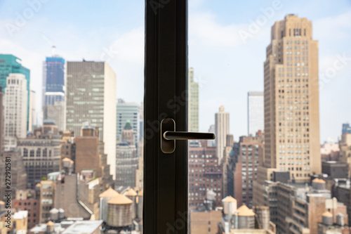 Photography View of Manhattan skyscrapers, New York city, out of a glass window