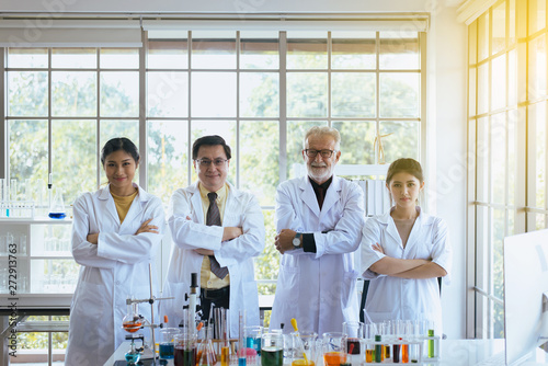 Scientists standing and cross arms,Group of diversity people teamwork in laboratory,Success and reserch working photo