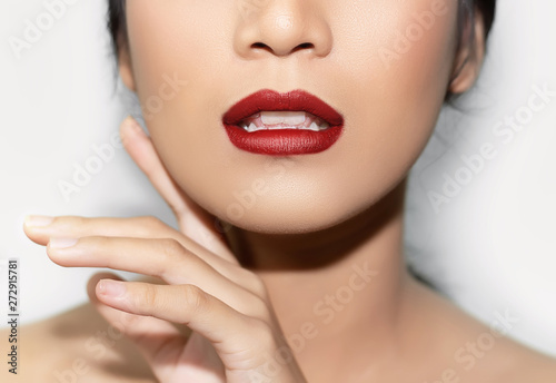 Fotografie, Obraz beautiful woman's face From nose to chest Showing bright red lips And clean, hea
