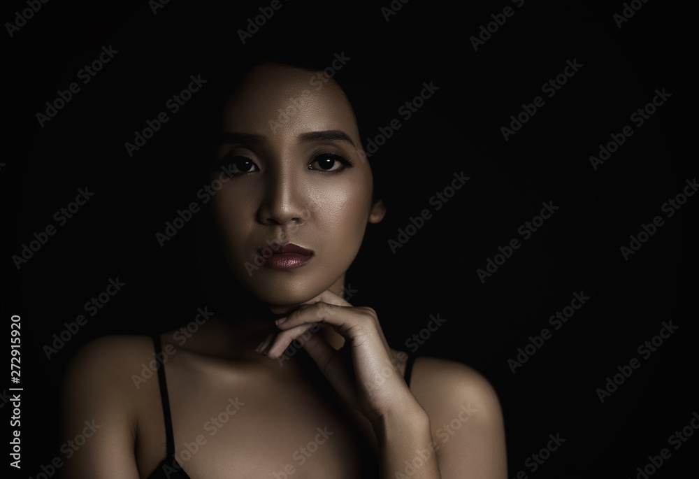 beautiful young woman closeup face and glossy skin under glamour low key concept beautiful young woman closeup face and glossy skin under glamour low key concept