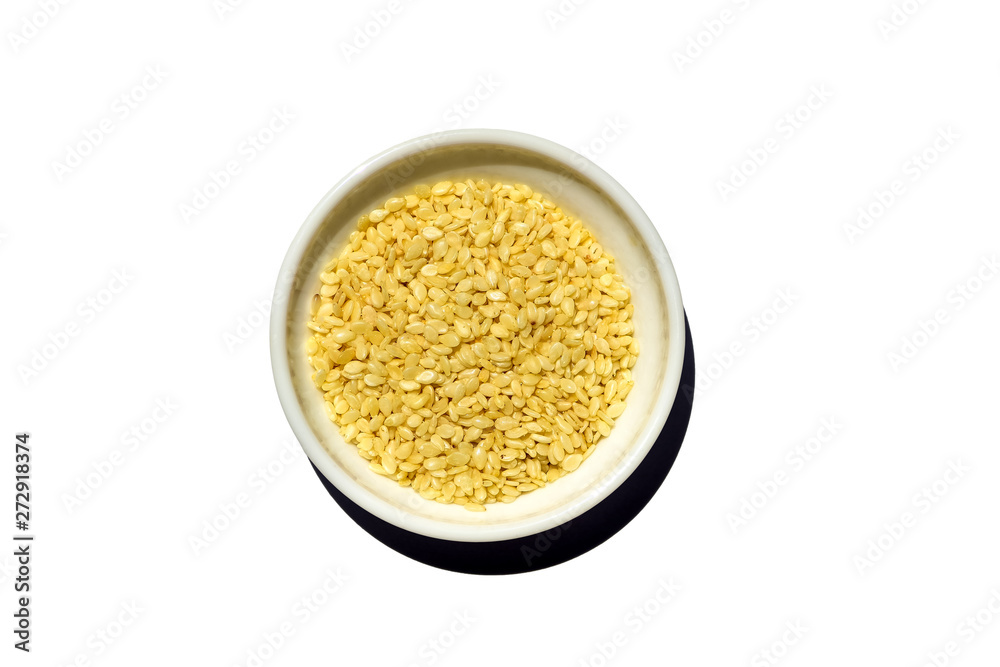 Saucer dish with sesame seeds isolated on white background Saucer dish with sesame seeds isolated on white background