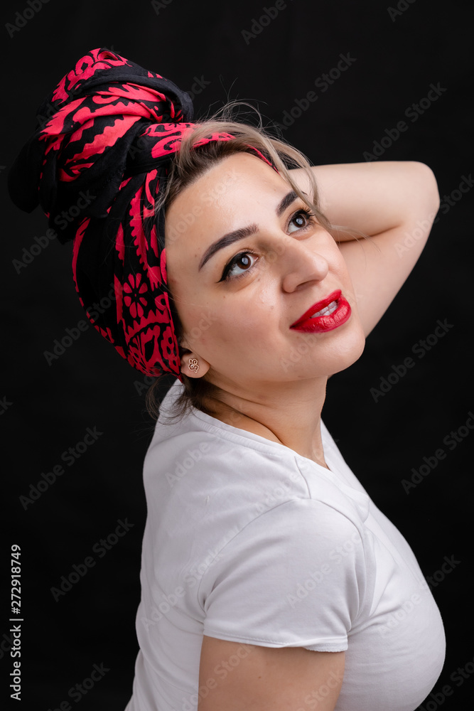 Dreams of a woman in a silk handkerchief, a white t-shirt on a black background. Dreams of a woman in a silk handkerchief, a white t-shirt on a black background.