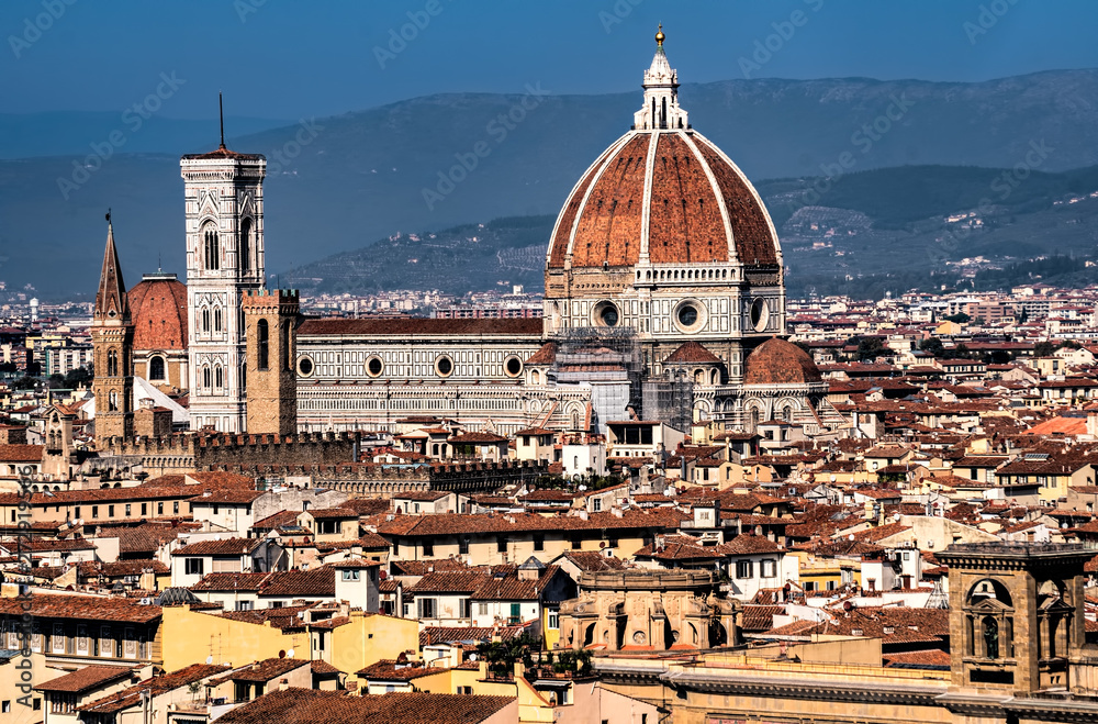 A cityscape view of Florence with the cathedral (Duomo) in the foreground. 