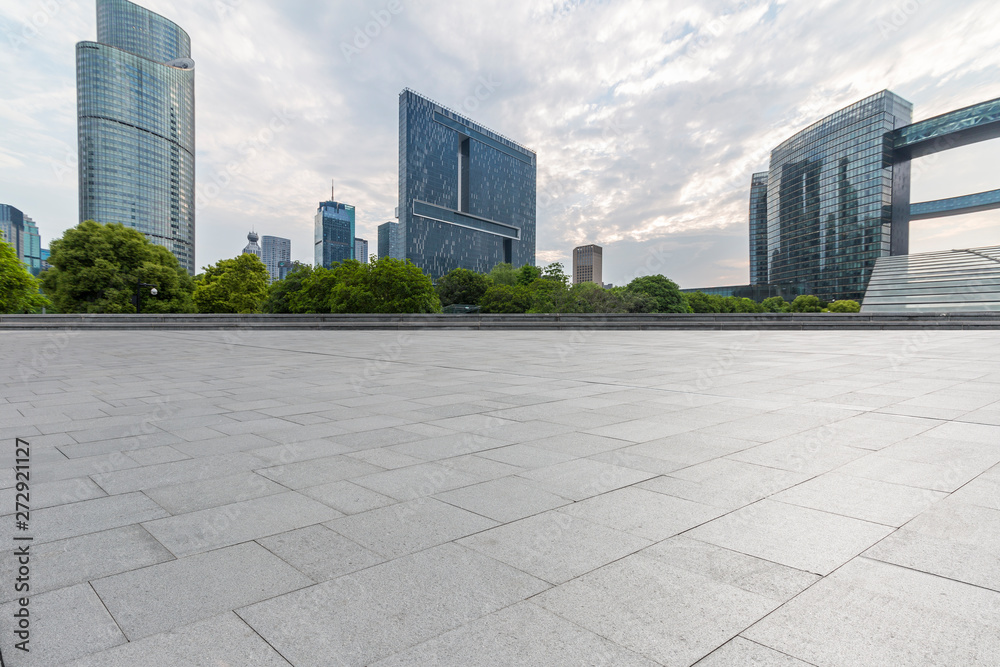 Panoramic skyline and modern business office buildings with empty road,empty concrete square floor Panoramic skyline and modern business office buildings with empty road,empty concrete square floor