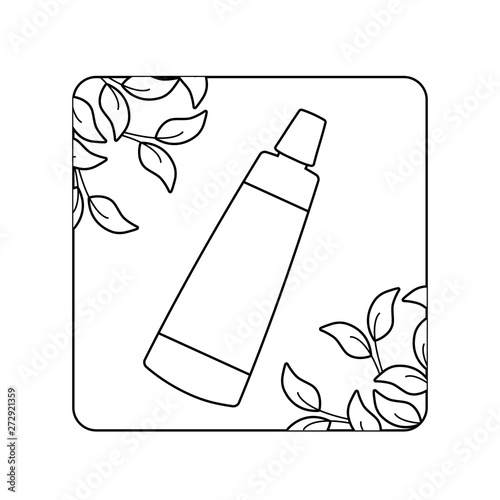cream tube cosmetic in frame with natural leafs