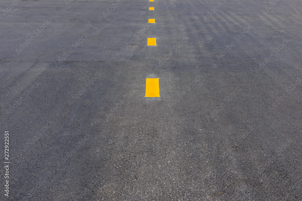 Yellow dot line for broken lane on asphalt road, road marking