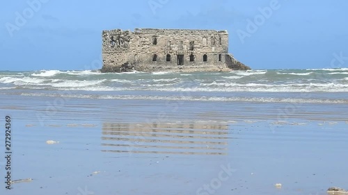 Casa Del Mar. The Atlantic ocean, the Cape Juby, the ruined fortress, a tide, sand beach,Tarfaya city, Morocco photo