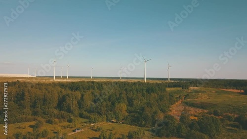 Windmills in summer filde in Estonia, drone footage photo