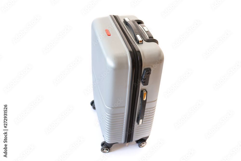 Fototapeta premium One suitcase isolated on white background. Polycarbonate suitcase isolated on white. Grey suitcase
