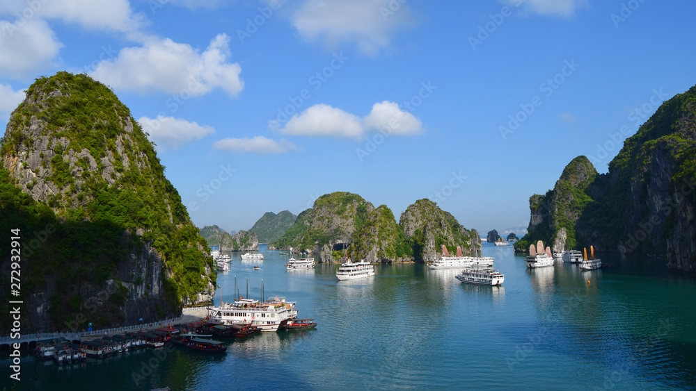 Karst landforms in the sea y Tourist junks in Halong bay in Vietnam, South Asia. The world natural heritage. Travel destination.