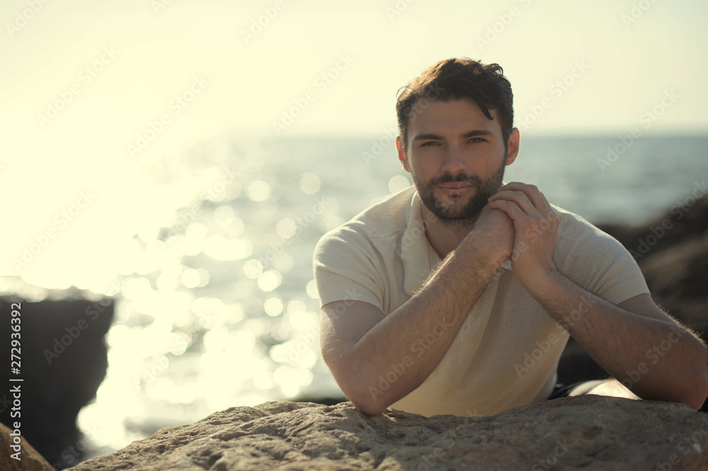 Young stylish man outdoor photo near the sea