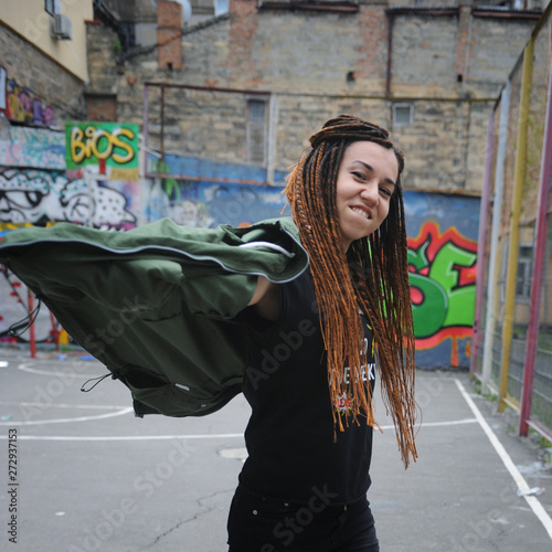 Smiling young woman portrait with dreadlocks