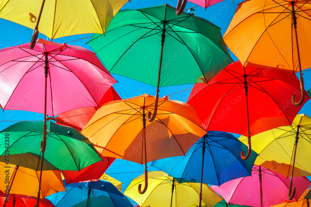 Colorful umbrellas in the sky as background. Street decoration.  