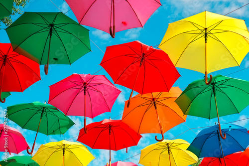 Colorful umbrellas in the sky as background. Street decoration.