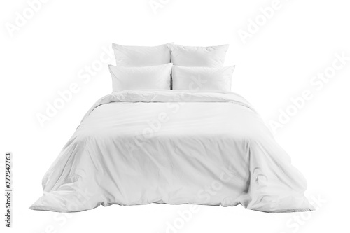 White bedlinen on a white bed isolated. Bedroom with bed and linen. Bed with pillows and duvet isolated.