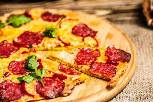 Pieces pizza with cheese and salami
