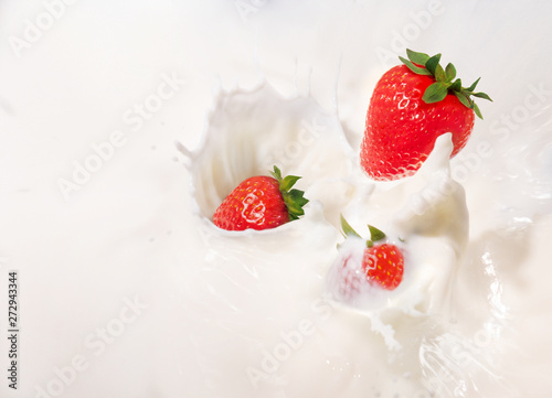 milk splash with juicy strawberries