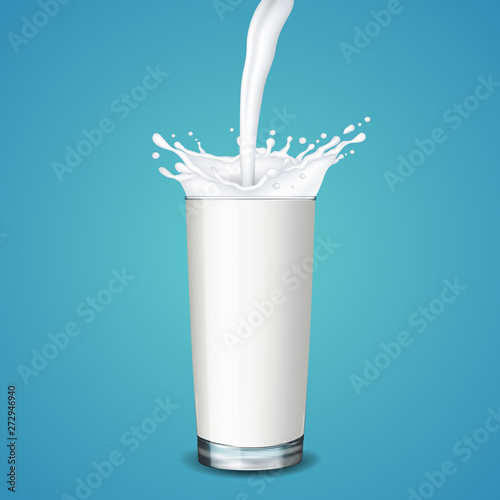 Glass of milk with splash, isolated on blue background.