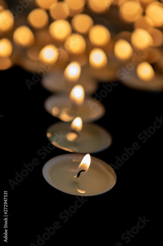 Many small burning candles