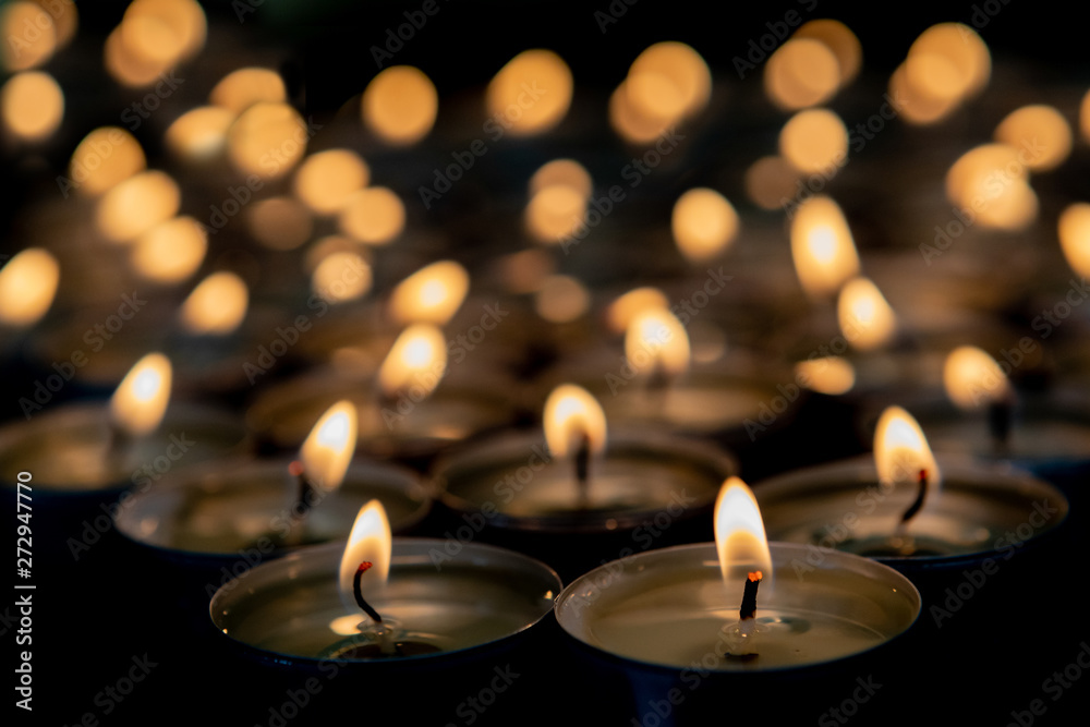 Many small burning candles