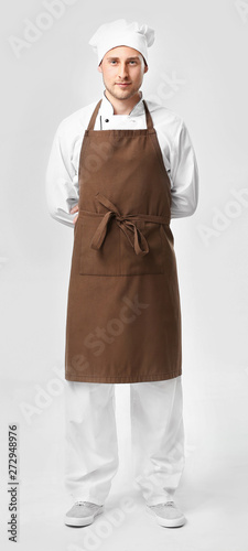 Handsome male chef on white...