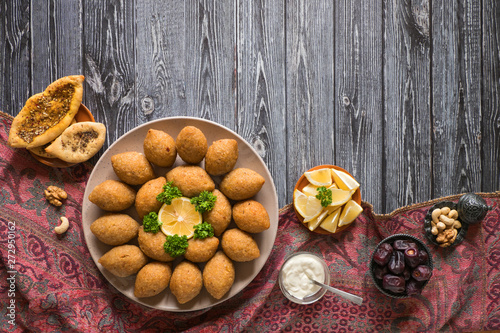 Arabic meat appetizer Kibbeh. Traditional Arabic kibbeh with lamb and pine nuts photo