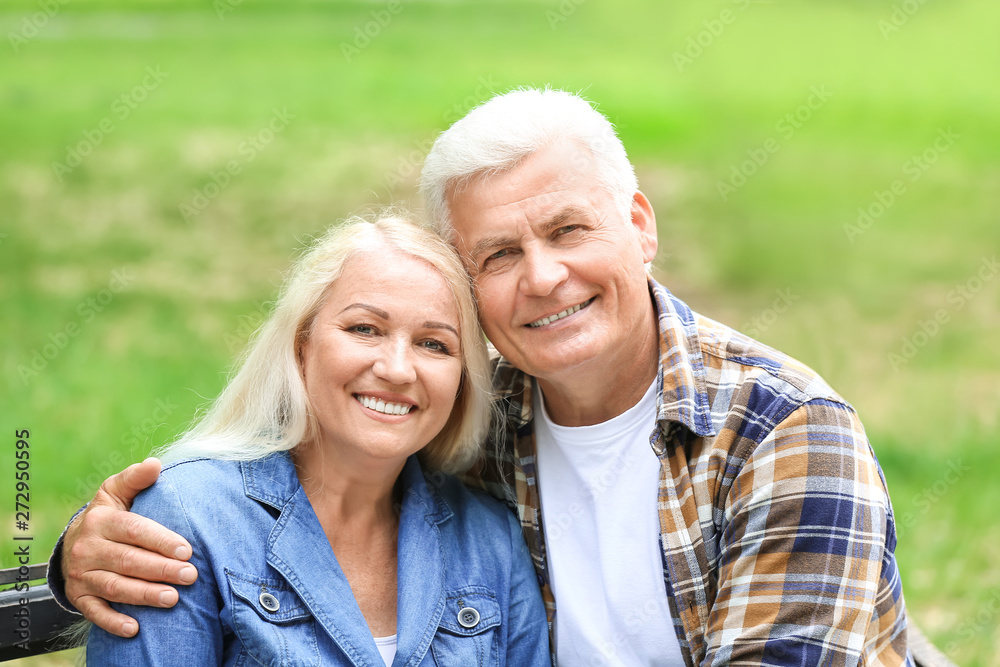Portrait of happy mature couple in park Portrait of happy mature couple in park
