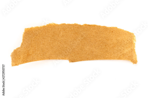 A piece of torn brown craft paper, shot from the top on a white background with a place for text