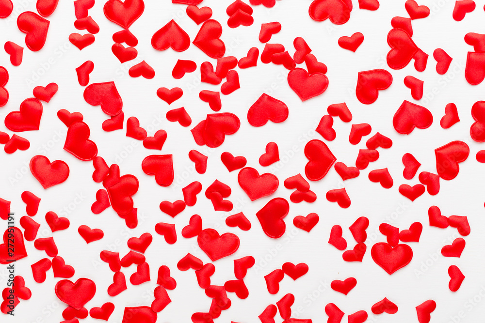 Valentines day background red hearts on white wooden background.