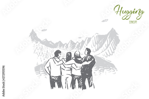 Young tourists enjoying view, men and women hugging, active recreation in mountains, fir tree forest, landscape tourism