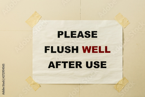 funny paper print flush slogan on toilet wall