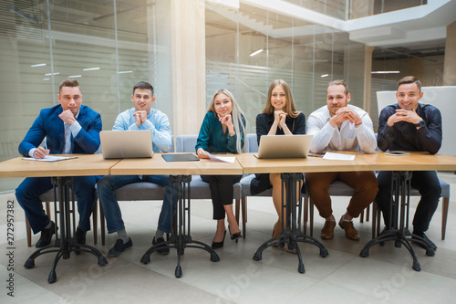 team of young professionals men and women at work in the office