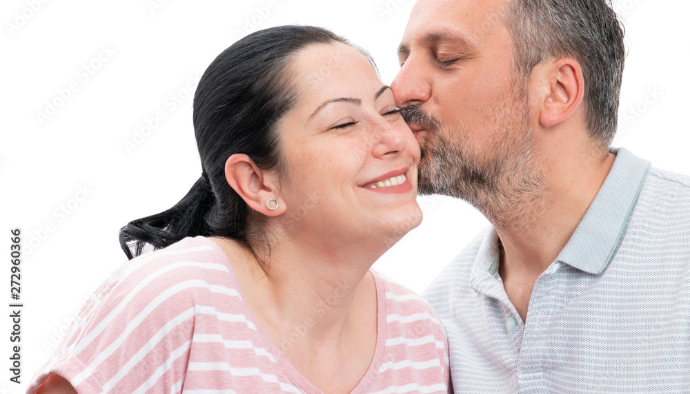 Closeup of man kissing woman cheek Closeup of man kissing woman cheek