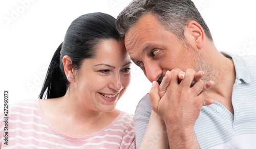 Closeup of man kissing woman hand