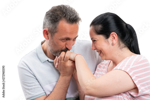 Man kissing woman hand as romantic gesture