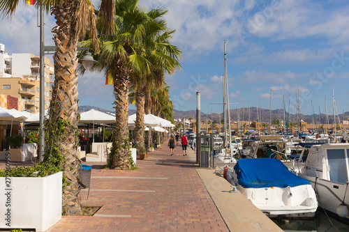 Puerto de Mazarron harbour Murcia Spain with cafes and palm trees and boats 