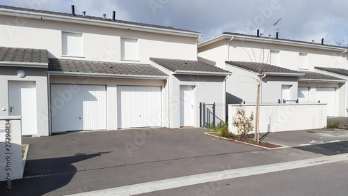 row of modern white semi-detached houses