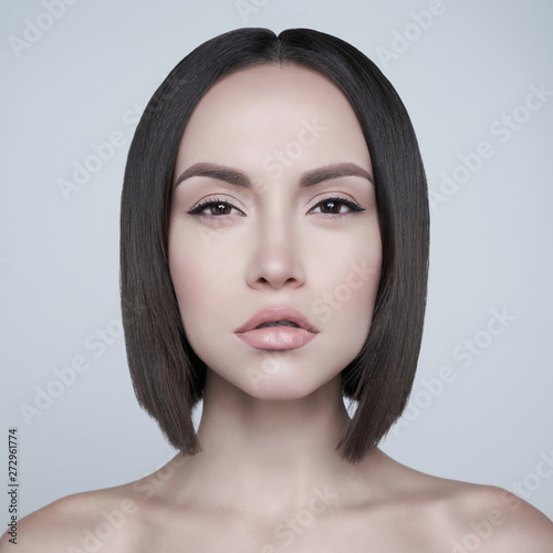Canvas Fashion beautiful brunette with short haircut.  studio portrait