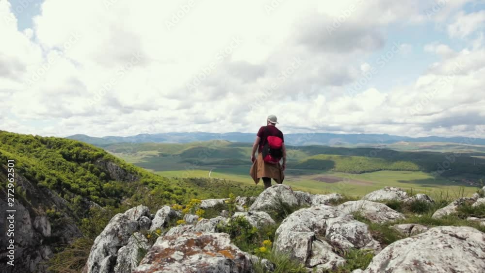 Walking on the edge of the cliffs with a beautiful view over the mountains. Walking on the edge of the cliffs with a beautiful view over the mountains.