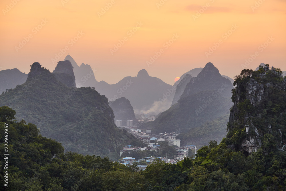 Scenic sunset over Karst mountains in Guilin, China.
