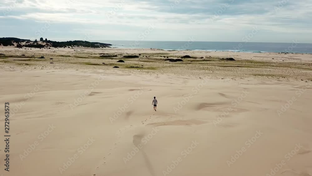 Cinematic Drone Aerial of Big Sandy Landscape With Lonely Man Walking to Beach in Stockton National Park Australia 4k Cinematic Drone Aerial of Big Sandy Landscape With Lonely Man Walking to Beach in Stockton National Park Australia 4k