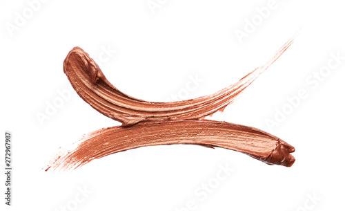 Bronze or gold texture of lip gloss or creamy eye shadow