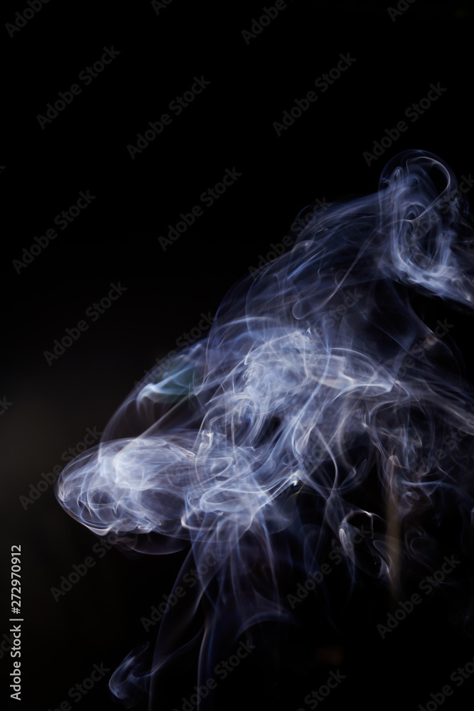 White smoke movement on black background.
