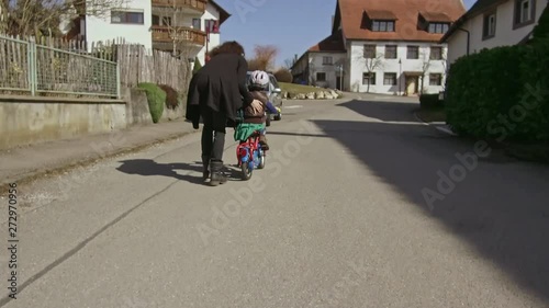 Wallpaper Mural A Little Child Learns How To Ride A Bicycle With Her Mom 1 Torontodigital.ca