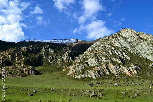 Green rock hills on a sunny day.