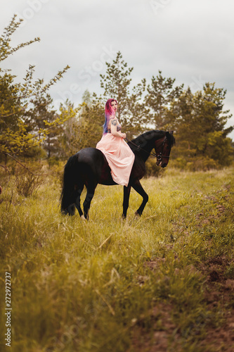 Girl on a black horse