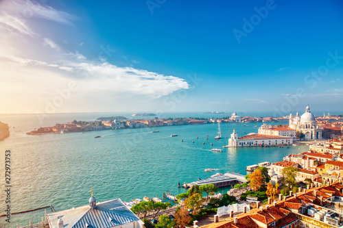 Aerial view of Venice, Santa Maria della Salute with Guidecca during early morning summer day. World famous Venice landmark. View from St Mark Campanile. photo