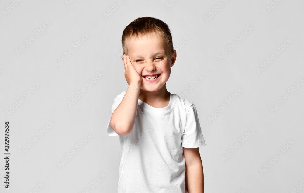 Surprised boy looking at the camera. Beautiful happy child, isolated on white background Surprised boy looking at the camera. Beautiful happy child, isolated on white background
