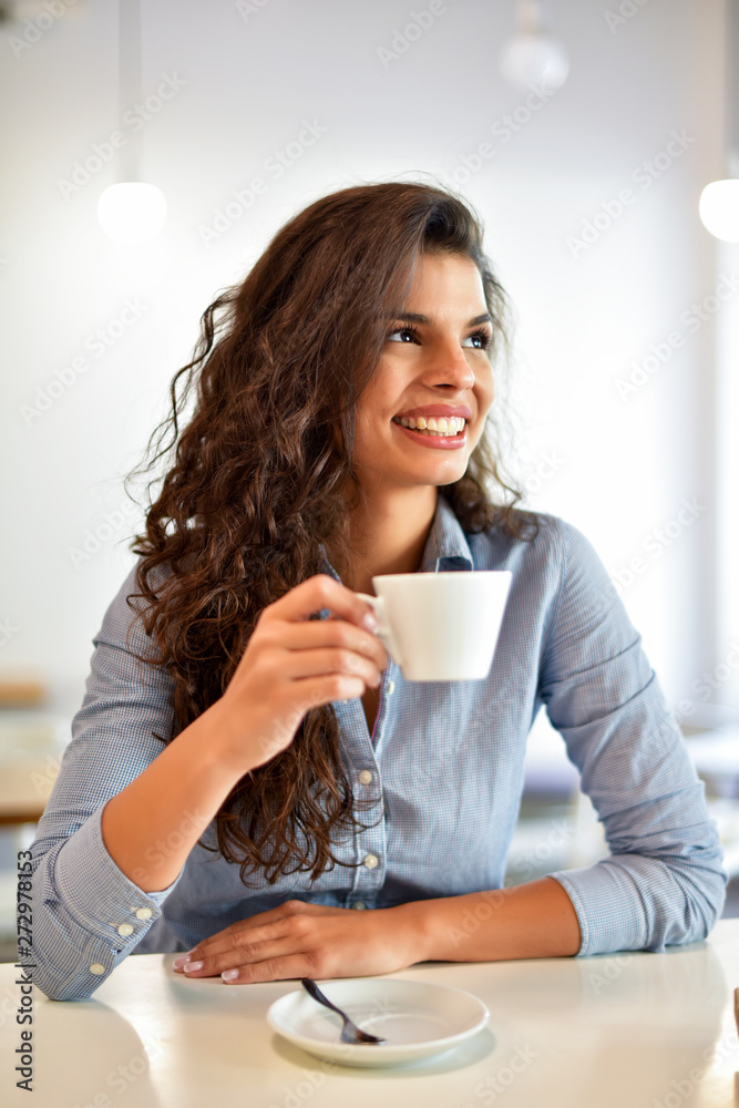 Happy woman having a coffee Happy woman having a coffee