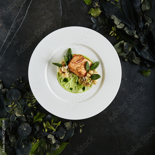 Fotografie Restaurant Plate with Fillet of Salmon 48 Degrees, Green Peas Cream and Burnt Ca